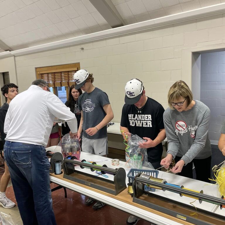 Volunteers packing Project Hunger food bags at a community event